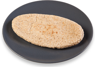 Wholemeal pitta bread on plate Wholemeal pitta bread on plate