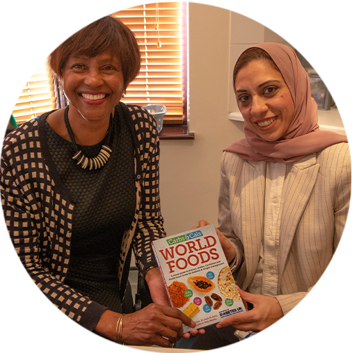 Dr Joan St John & Salma Mehar with Carbs & Cals World Foods book